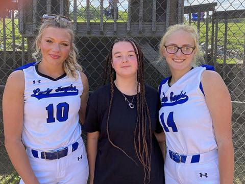 April McNabb/Contributing Photographer The Lady Eagles celebrated Senior Night on Thursday. Softball seniors Katie McNabb (left) and Shelby Kester (right) were joined by Miranda Landon (middle), a senior on the Eagles’ track and field team.