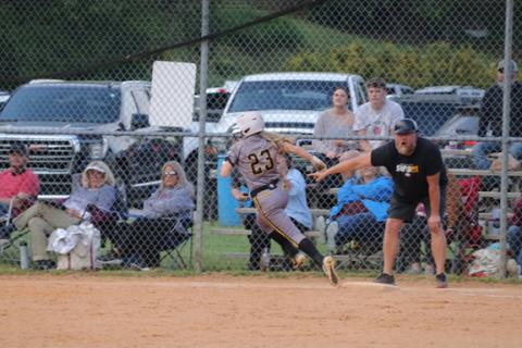 David Guffey/ Contributing Photographer Murphy’s Emma Hensley rounds third with the “go” sign from coach Billy Dockery on Friday.