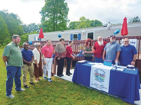 Nicole Wright/Staff Correspondent Cherokee County commissioners, past and present, joined officials and clients in celebrating the Department of Social Services’ new children’s Cottage of Hope on May 21.