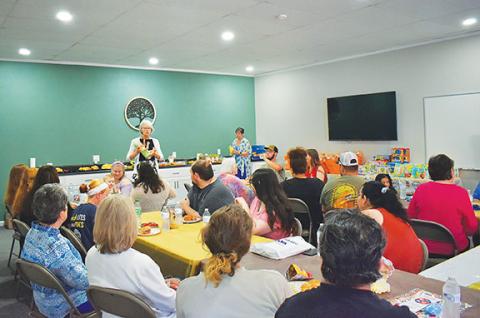 Anngee Quinones-Belian/Staff Correspondent Retired registered nurse and labor and delivery coach Susan Bekken instructs moms on how to nurse their babies. The free class was offered at Choices Murphy Pregnancy Center on May 29 as part of a community baby shower presented by Reach of Cherokee & Graham Counties.