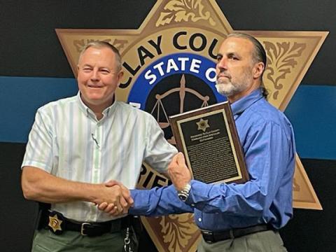 Clay County Sheriff Mark Buchanan (left) presents Ed Figueroa, a resident of Cherokee County, with an Appreciation for Exemplary Service award.