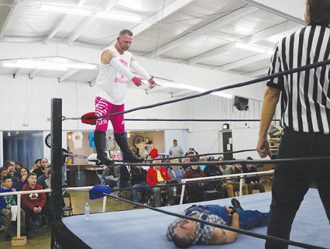Cannon Crompton/sports@cherokeescout.com Axel Freakin’ Gunn sets up a big move from the middle ropes on Mountain Man Jeremy Stiles during the ACWF Valentine’s Massacre on Feb. 3.