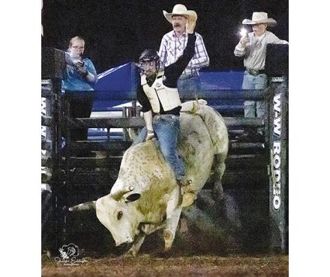 Jennifer Eddington/Contributing Photographer Bailey White – son of Jason and Melissa White who run the Great American Rodeo – rides their bull, Brandon, at the first Abbeville (S.C.) Shriners Great American Rodeo on June 14. Bailey, 23, is an electrical engineer from Mineral Bluff, Ga.