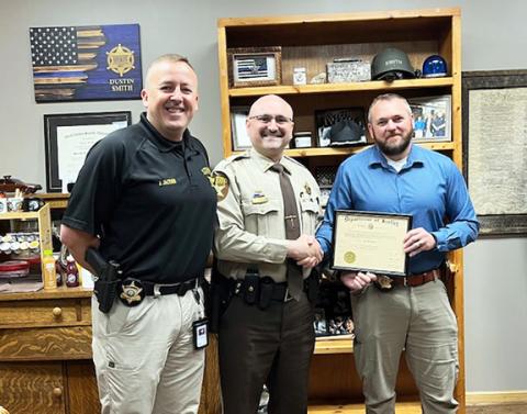 From left are Cherokee County Sheriff’s Office Chief Deputy Justin Jacobs, Deputy Brandon Morgan and Sheriff Dustin Smith.