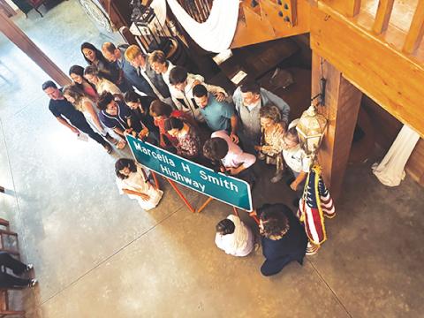 Randy Foster/editor@cherokeescout.com Relatives of Marcella Hampton Smith pose for pictures during a road-naming ceremony at McGuire’s Millrace Farm in Peachtree on Thursday.