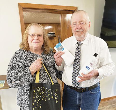 The Rev. Gerald Derreberry/Contributing Photographer  Janice and Evan Mack from Shady Grove Baptist Church in Murphy hold care bags that will be distributed to the local homeless shelter as part of a project under the ServeNC Initiative, which demonstrates the love of Christ in communities around the state.