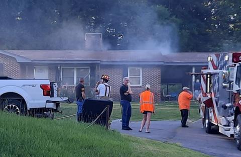 Anngee Quinones-Belian/ Staff Correspondent Smoke could be seen coming from the roof of a single-story home in Ranger on June 25. The fire was believed to have started in the kitchen. No injuries were reported. 