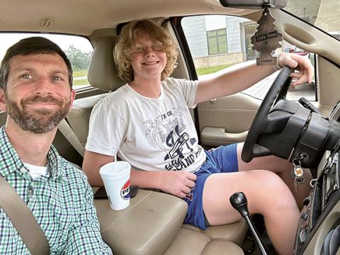 Photos by Stacy Van Buskirk/Staff Correspondent Big Brother Wil Posey of Murphy gives his Little Brother Lucas Burrell, 15, of Murphy, a lesson on driving a vehicle with a stick shift. The duo have been matched for six years and, since Lucas is about to get his learner’s permit, Posey figured it was time he learned to drive a manual transmission vehicle.