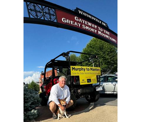 Greg Moore and his dog, Carhart, are ready to begin their trek in a side-by-side across North Carolina – from Murphy to Manteo.