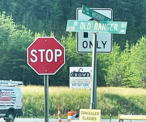Dave Cline/ Contributing Photographer The right-turn-only sign is hidden behind the scenes at Old Ranger Road and U.S. 64 West in Murphy.
