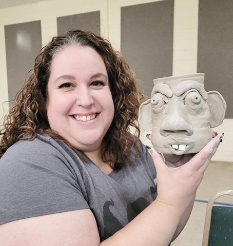 Staff Correspondent Stacy Van Buskirk at the first Face Mug Party she ever attended at the Brasstown Community Center.