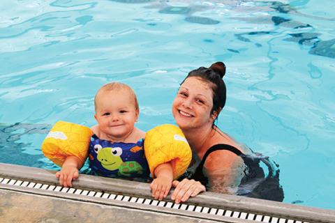 Stacy Van Buskirk/Staff Correspondent Splish splash: Olive Smith of Murphy and her son Elijah, 18 months old, enjoy a day swimming and splashing in the Murphy Health & Fitness Center’s pool.