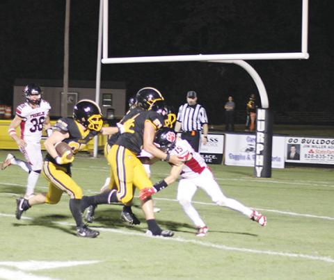 Jason Pinkerton/Contributing Photographer Kadence Leatherwood rushes the ball toward the end zone against Franklin on Friday night. 