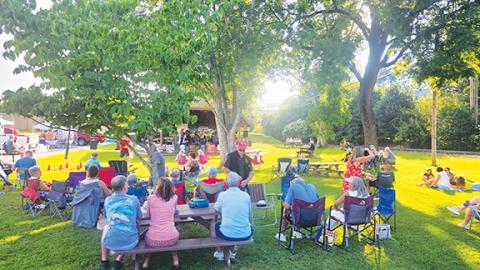 Photos by Nicole Wright/Staff Correspondent Crowds enjoy the last Food Truck Friday of 2024 at Hall Memorial Park in downtown Andrews. Each twice-monthly event features live music, along with artists and vendors.