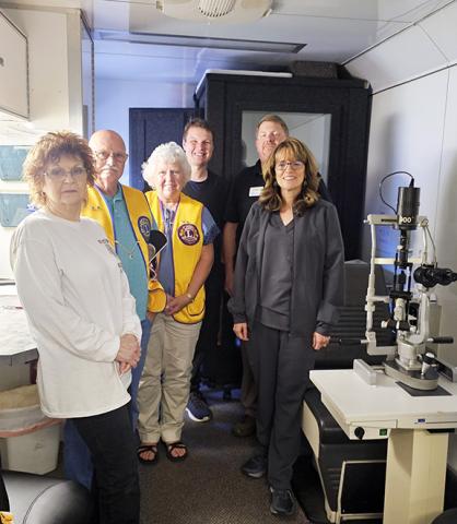 Nicole Wright/Staff Correspondent The Mobile Screening Unit of Lions Club International held a hearing and vision screening Friday in Andrews with the help of local Lions Club officers, members and volunteers. From left are Rhonda Eunice, vice president of the Andrews Lions Club; Clifford Panter; secretary/treasurer Claudette Morgan; eye exam technician Logan Hosch; Dr. Lynn Taylor; and Mobile Screening Unit Director Bryan Hoover of the Lions Foundation of North Carolina.