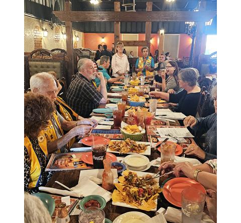 Nicole Wright/Staff Correspondent Murphy Rotary Club President Jacky Egli (left) and Andrews Lions Club President Barbara El-Khouri share a message of working together Thursday to members of both clubs at Monte Alban Restaurant in Andrews.