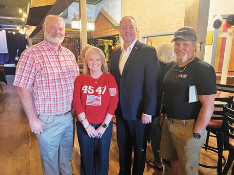 Welcome to the party: Buddy McMillan (left), Kadee Close, Mark Kephart (right) and other Cherokee County Republican Party members meet with N.C. GOP Chair Jason Simmons on Sept. 6 at The Mason Bar in Murphy.