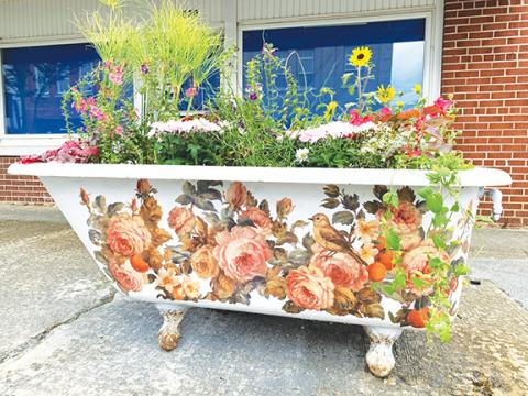 Lynnie Anderson/Contributing Photographer Southern beauty: Bathtubs and colorful flowers help maintain the beauty of downtown Andrews.