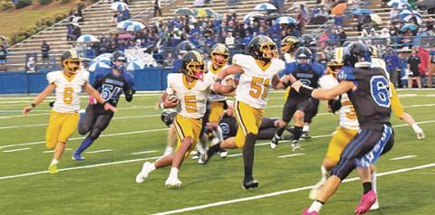 J.R. Carroll/Staff Correspondent Murphy’s Cameron Clem runs for yardage as Landon Late leads the way against Smoky Mountain on Thursday.