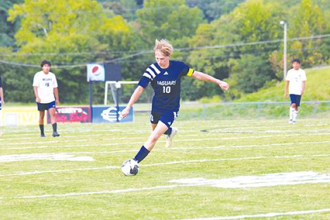 Cannon Crompton/sports@cherokeescout.com Landen Spies of Tri-County takes a free kick in the first half against Summit Charter on Sept. 4.