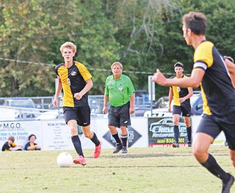 Cannon Crompton/sports@cherokeescout.com Tyler Payne of Murphy passes the ball ahead in their match against Highlands on Sept. 18.