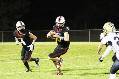 Cannon Crompton/sports@cherokeescout.com Andrews quarterback Everett Tatham runs the ball against Hayesville on Sept. 6.