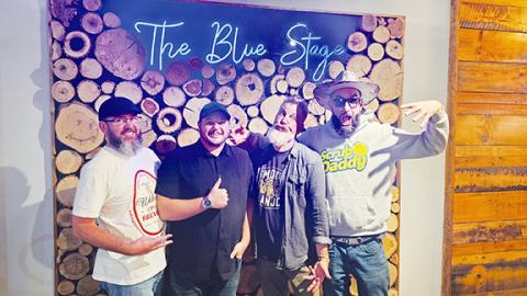 Nicole Wright/Staff Correspondent Four east Tennessee comedians performed Aug. 16 at The Blue Stage in Andrews. From left are emcee and manager Chris Travis of Knoxville, Tenn.; warm-up act James Osborne of Knoxville; headliner, author and teacher Alex Stokes; and featured comedian Paul “PG” Cohen of Newport.