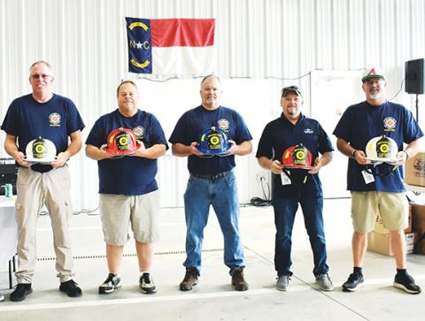 Photos by Bill Belian/Contributing Photographer  Five members were honored for their 30 years of service each to the Hiwassee Dam Fire Department. They received leather helmets and gratitude at the 50-year anniversary celebration on Sept. 7. From left are Chief Chad McNabb, Capt. Phil Hackler, Michael Starks, Lt. Stanley Graham and assistant chief Daniel McNabb.