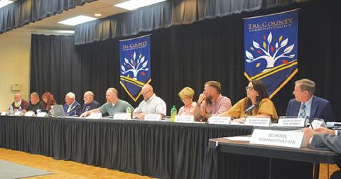 Photos by Randy Foster/editor@cherokeescout.com Above: Cherokee County commissioners (left) sit at the table with school board members (right) during a joint meeting at Tri-County Community College on Sept. 16. Below: More than 60 people attended the joint meeting.