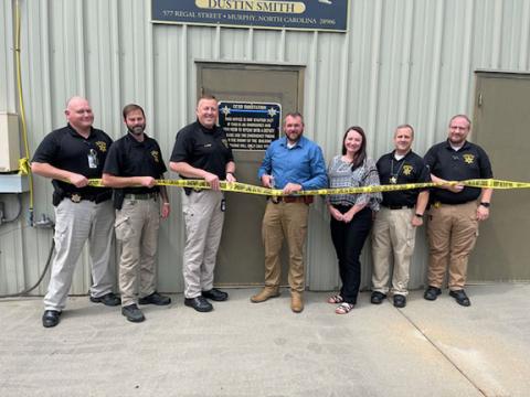 At the ribbon cutting for the Cherokee County Sheriff’s Office’s new Hiwassee Dam substation on Sept. 4 are (from left) Capt. David Williams, Investigator T.J. Major, Chief Deputy Justin Jacobs, Sheriff Dustin Smith, victim’s advocate Stephanie Swanson, Lt. Sport Teasdale and Investigator Jason Hall.