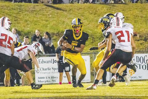 Cannon Crompton/sports@cherokeescout.com Cameron Clem of Murphy runs through the defense in their game against Andrews. Clem had a five-touchdown performance Friday night.