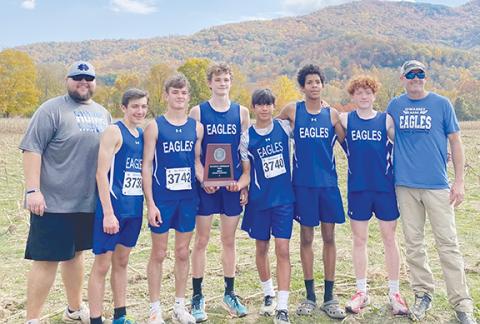 Christy Russell/Contributing Photographer The Hiwassee Dam boys cross-country team holding their trophy after finishing second in team points at the 1A West Regional meet in Bryson City on Saturday. Pictured are (from left) coach Josh Barton, Maverick Hawley, Ethan Russell, Jonah Dockery, Oscar Page, Xavier Johnson, Abel Penland and coach Andy Russell.