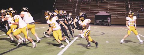 J.R. Carroll/Staff Correspondent Murphy’s Way Herron on his way to his first high school touchdown against Hayesville on Friday night.