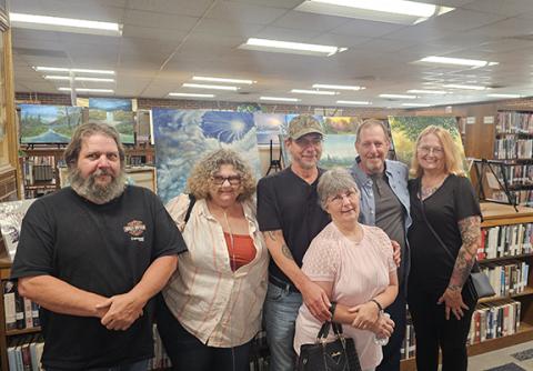 Photos by Nicole Wright/Staff Correspondent From left are Joe and Mary Ann Sayre, Tom and Teresa Vogler, Darrell and Debbie Vogler. The September Art Showcase at the Andrews Public Library for artist Tom Vogler turned into a family reunion of sorts, with the artist’s brother Darrell and wife Debbie, along with sister Mary Ann Sayre and husband Joe, visiting to attend. This was the first time the siblings were in the same room for 35 years. 