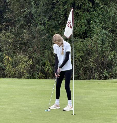 Kary McClure/Contributing Photographer Ellie McClure of Murphy sets up to putt at Sequoyah National in Cherokee at the second round of the Smoky Mountain Conference tournament on Oct. 15. 