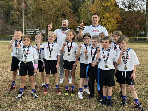 Racquel Mabry/Contributing Photographer The 8u Bills youth football team won their championship on Oct. 24. Pictured in the back row (from left) are coach Justin Daugherty and coach Brandon Brown. In the front row (from left) are players Beckett Brown, Keyari Allen, Ethan Gray, Raylan Mashburn, Ella Mabry, Jaxon Patterson, Elijah Harding, Luke Michaels, Jude Daugherty and Isaac Waldroup.