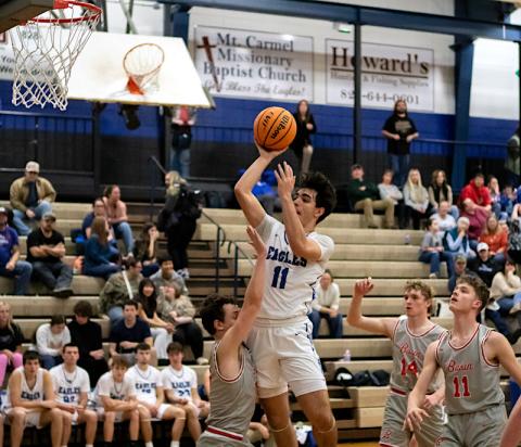 Cannon Crompton/sports@cherokeescout.com Aidan Bennett of Hiwassee Dam drives to the hoop through the air against Copper Basin, Tenn., on Friday. 