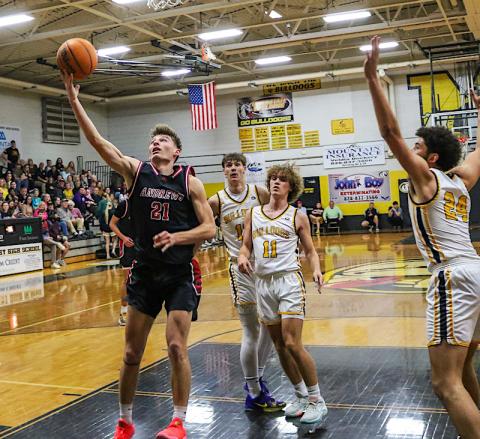 Cannon Crompton/sports@cherokeescout.com Ty Clark of Andrews drives to the basket to make up a layup against Murphy on Feb. 6.