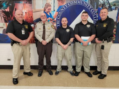 Cherokee County sheriff’s Capt. David Williams, Deputy Eddie Hardin, Graduate Deputy Robert Manning, Graduate Deputy Hunter Dezess and Chief Deputy Justin Jacobs (from left) celebrate Basic Law Enforcement Training graduation on Nov. 8 at Tri-County Community College.