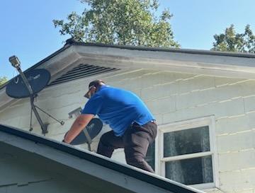 Juan Aguilar of RRG Roofing & Gutters in Murphy is aware of the hazards of working atop a roof and takes extra precautions to prevent injuries.