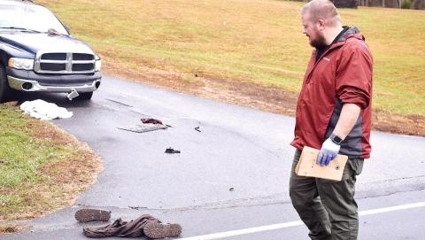 Clay County Sheriff's Lt. Tyler Faggard investigates the scene of a stabbing.