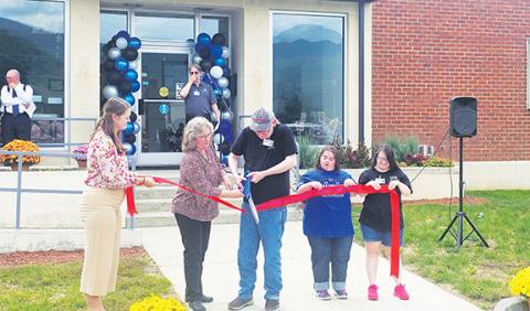 Nicole Wright/Staff Correspondent  A ceremonial ribbon cutting took place at IOI’s 50th anniversary celebration on Oct. 4 in Andrews. Taking part were (from left) Cherokee County Chamber of Commerce Executive Director Victoria Ivie, Andrews Chamber of Commerce Director Nola Cooper, David Hughes (representing the first 50 years of IOI’s commitment to employing and empowering adults with disabilities), Alyssa King and Nicole Casciato, who represent the newest and younger generations of those helped by the com