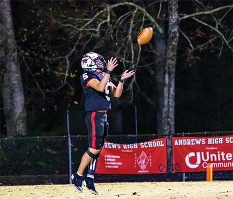Cannon Crompton/ sports@cherokeescout.com LaDannien Rattler of Andrews jumps to catch a punt against Hayesville on Friday night.