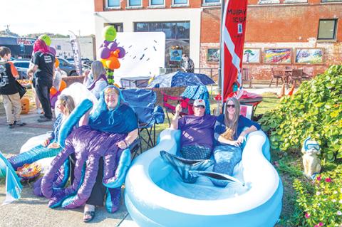 Sam Jokich/Staff Correspondent  Mermaids: Christa Young, Tina Vetter, Dan Vetter and Fran Parker (from left) were enjoying a cool time during A Murphy Haunting on Thursday. More photos, pages 8A and 12A.