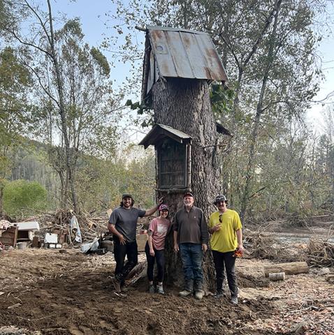 From left, volunteers Noah Spiker, Lydia Izzell, Danny Hensley and Owen Alexander spent Oct. 12 cleaning out the flooded basement of Hensley’s business and home in Pensacola, which was flooded by Hurricane Helene.