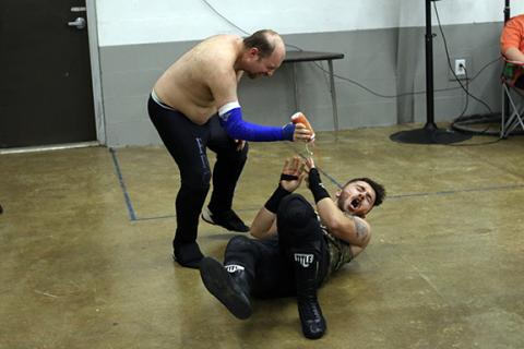 Cannon Crompton/sports@cherokeescout.com Frodo squirts barbecue sauce in the face of Flex Ferguson during the main event at ACWF Thanksgiving Chaos.