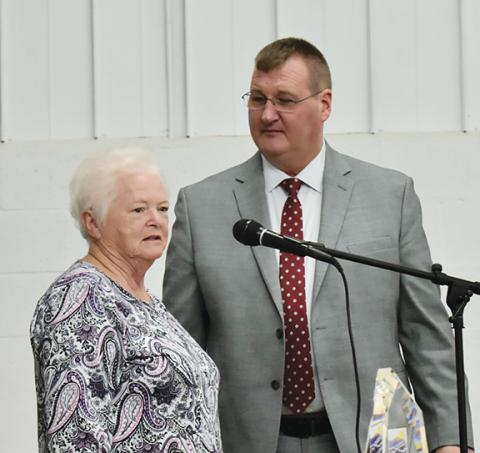Photos by Anngee Quinones-Belian/Staff Correspondent  Marcil Hurt, president and longtime volunteer of the Peachtree Community Club, receives recognition from Murphy Mayor Tim Radford on Oct. 20 for her time and dedication to the organization over the past 40 years.
