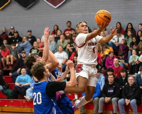Cannon Crompton/sports@cherokeescout.com Keegan Ellis of Andrews takes to the sky to shoot up layup against Hiwassee Dam on Nov. 26.