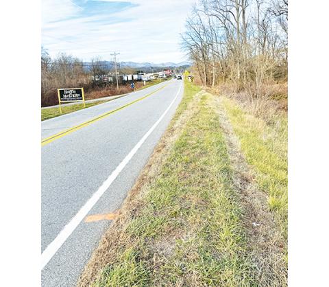 Randy Foster/editor@cherokeescout.com Four days after the crash, tire tracks still show where Ronnie Massey’s vehicle drifted off N.C. 141, hit a berm, jumped over Peachtree Creek and hit a tree on the far side of the creek. Massey was found dead at the scene.