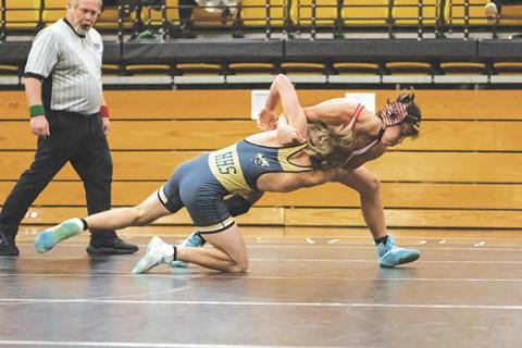 Cannon Crompton/sports@cherokeescout.com Chase Beasley of Andrews throws Will Denton of Hayesville to score a takedown in their match on Dec. 3.